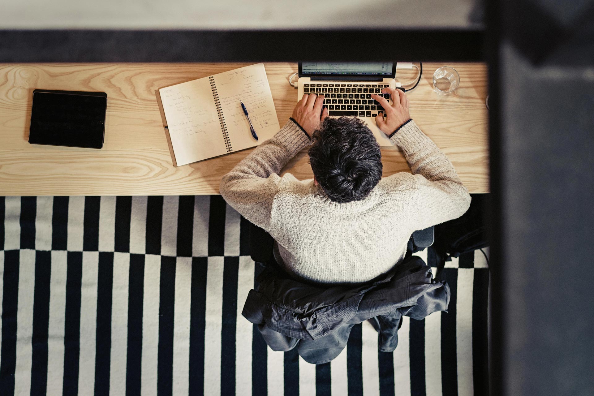 Man working with laptop on desk